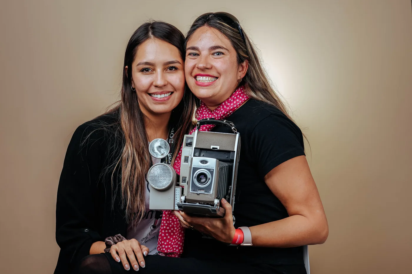The Look at You team with a vintage instant camera